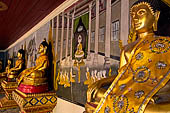 Chiang Mai - Wat Phra That Doi Suthep. The walls of the gallery are covered with Buddha statues and mural paintings of Jataka and tales of the previous lives of the Buddha. 